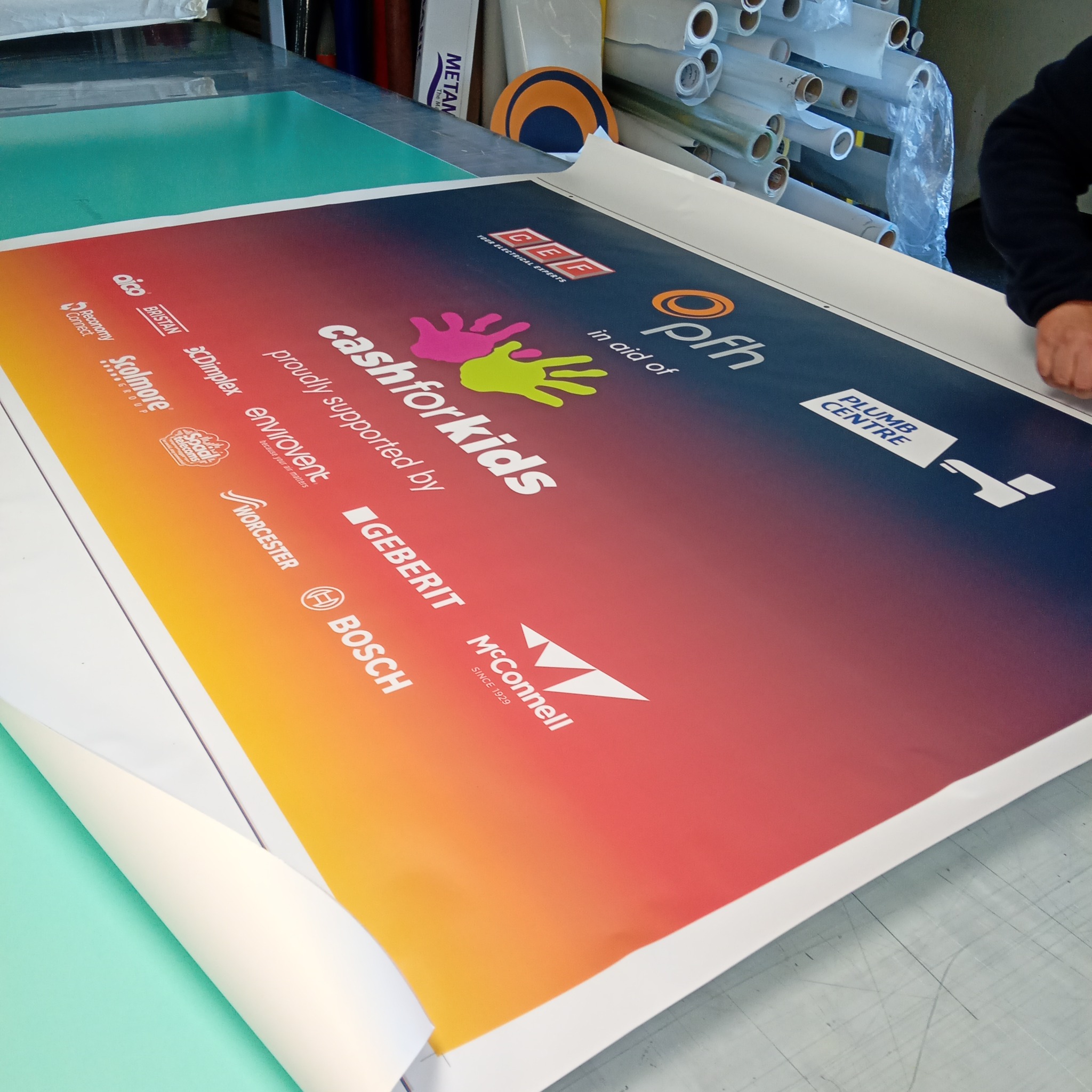 Cash for Kids charity event sponsor board printed by Backdrop Media